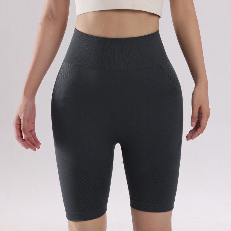 Model wearing high-waisted yoga shorts