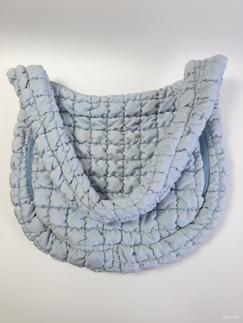 Side view of soft shoulder bag with detailed stitching