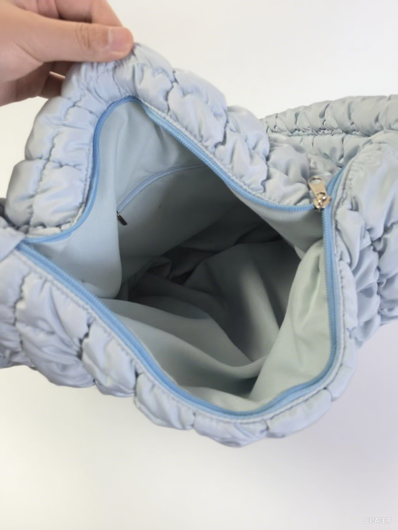 Back view of soft shoulder bag showing zipper closure