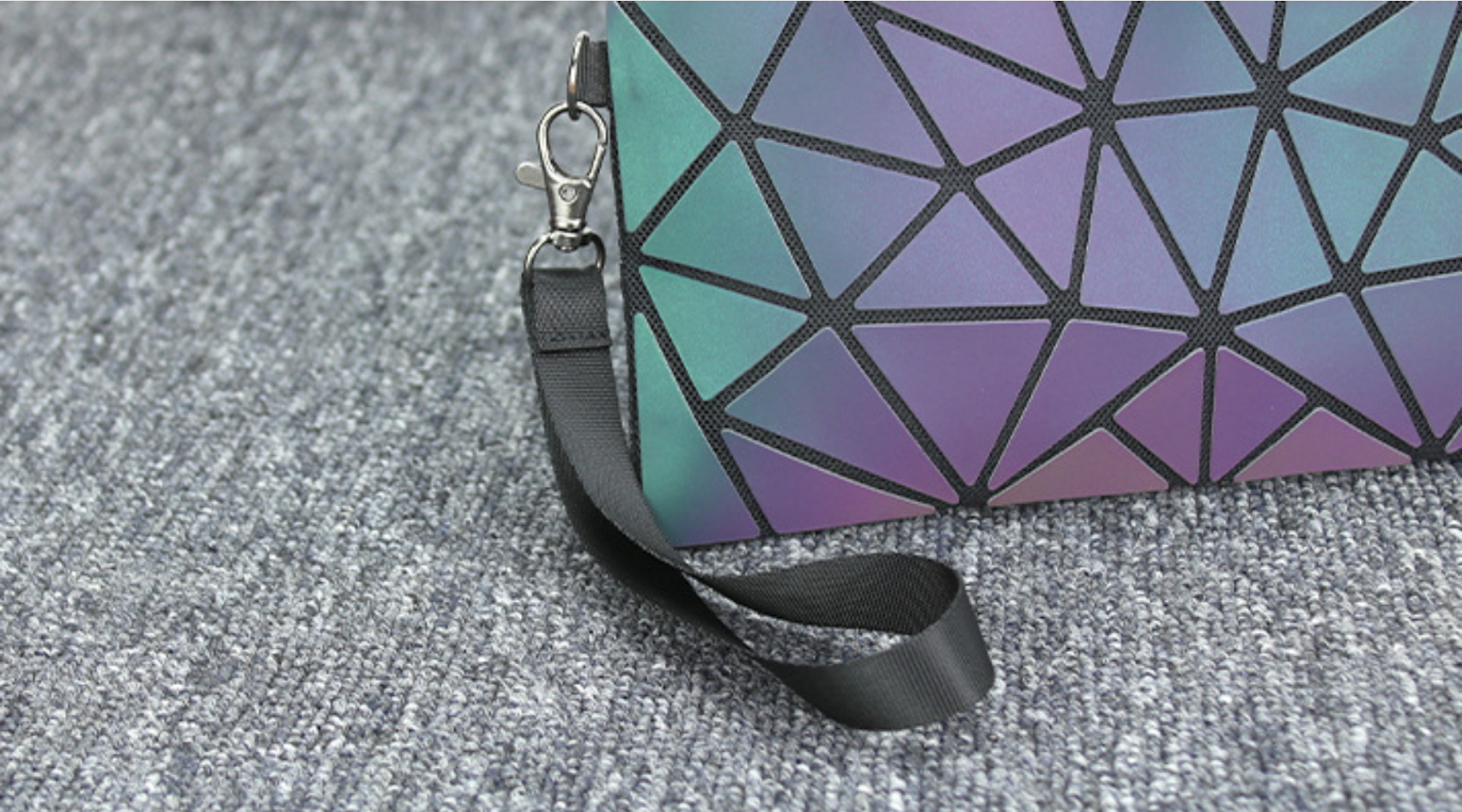 Detailed view of reflective geometric quilted promotional bag