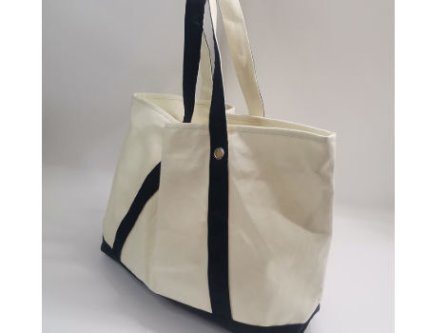 Side view of a canvas tote bag with promotional design