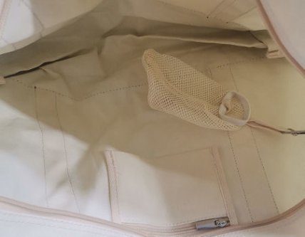 Back view of a canvas tote bag with handles