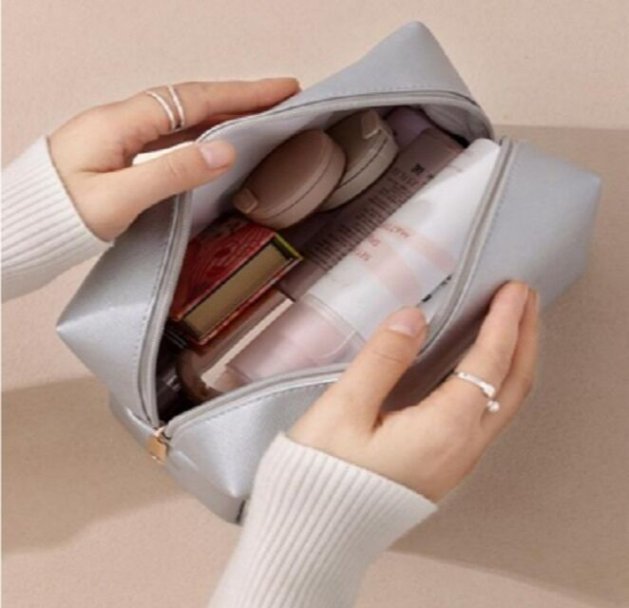 Black leather cosmetic bag for travel
