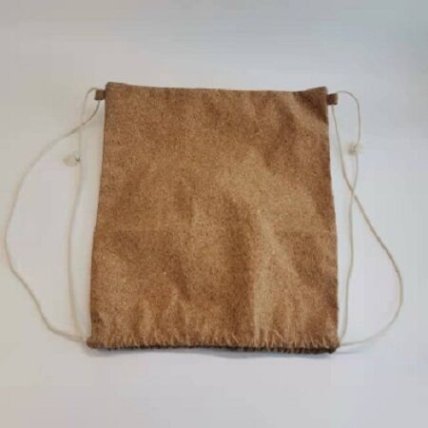 Side view of drawstring gift bag showing design details