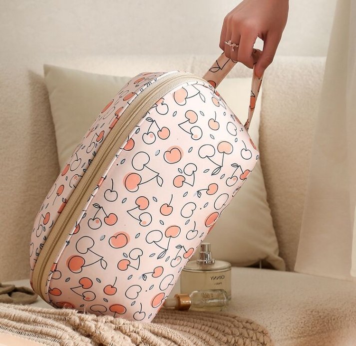 Open view of travel bra bag showing compartments
