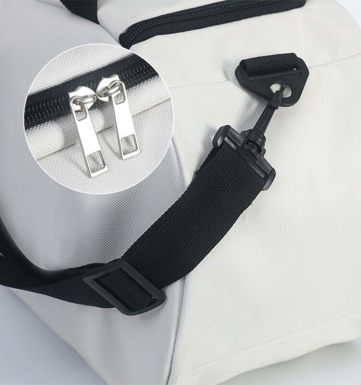 Carrying view of duffle bag, demonstrating its portability and ease of use