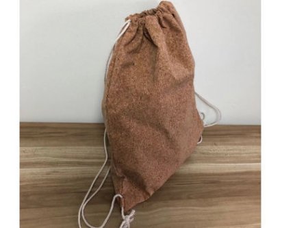 Side view of a drawstring bag showing its compact design