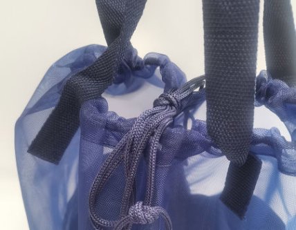 Advertising drawstring bag featuring promotional messages for brands